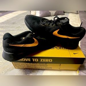 Womans Black and Gold Nike